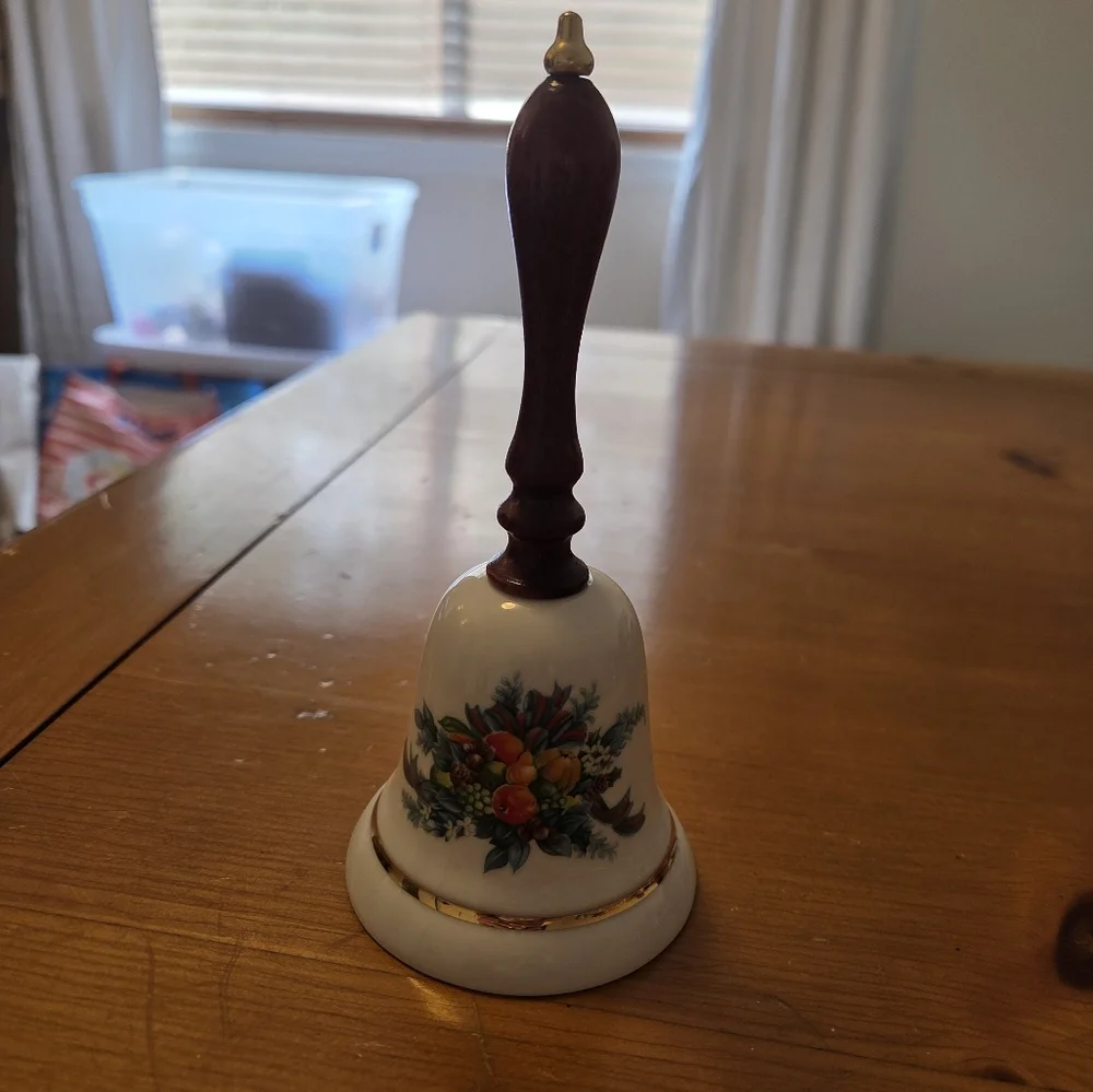Avon 1985 Porcelain Holiday Bell With Wooden Handle